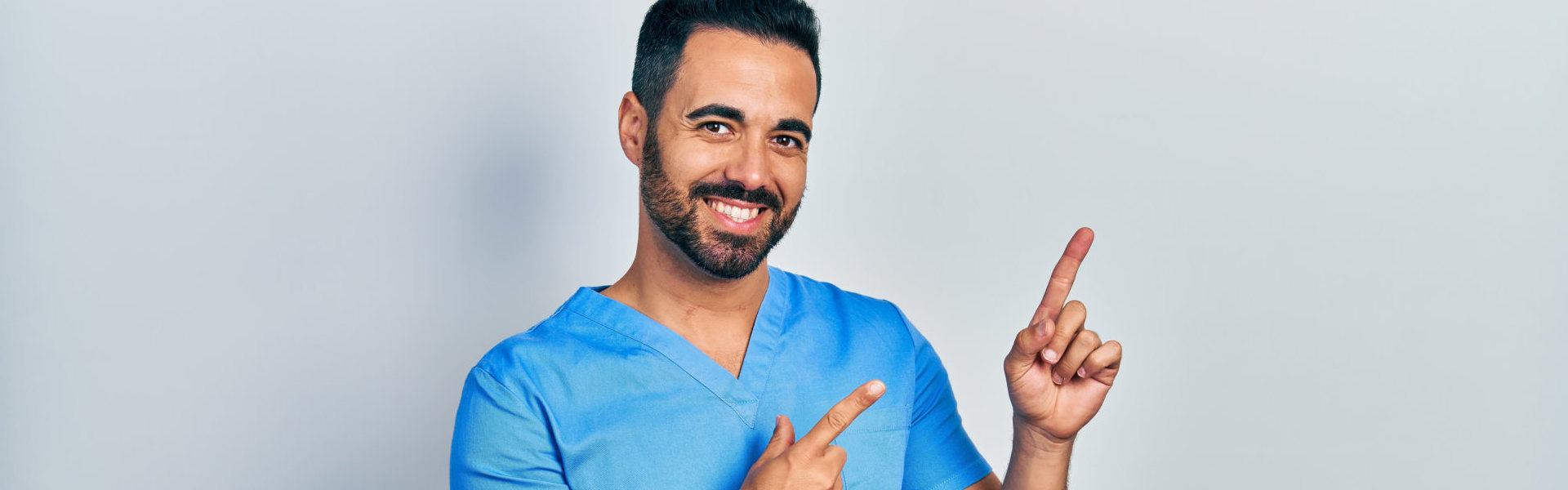 A male caregiver doing the pointy-finger pose