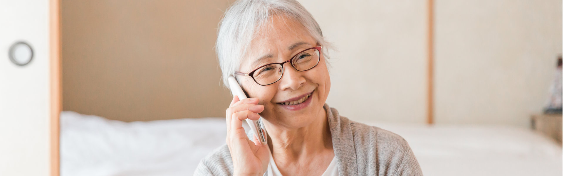 A senior woman calling through a mobile phone